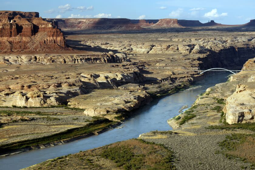 Hate Overlook, Lake Powell, UT-June 27, 2022-Hite Overlook on UT-95, Lake Powell, UT provides a view of the Colorado River in Arizona. The White Crossing Bridge can be seen in the background. The height of the Colorado River has fallen dramatically due to drought, overuse and mismanagement. June 27, 2022. (Carolyn Cole/Los Angeles Times)