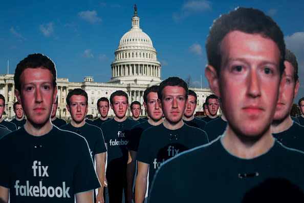 100 life-sized cutouts of Facebook CEO Mark Zuckerberg sit on the lawn of the U.S. Capitol on April 10. in Washington, DC. The advocacy group Avaaz placed the cutouts on the lawn to bring attention to the alleged hundreds of millions of fake accounts still spreading disinformation on Facebook ahead of Zuckerberg’s hearing before the Senate comittees. (Photo by Zach Gibson/Getty Images)