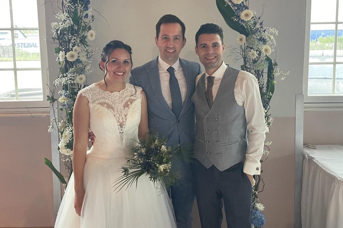 Mark (centre) with Natalie and Ramon at their wedding in Simbach, Germany on April 20 <i>(Image: Submitted)</i>