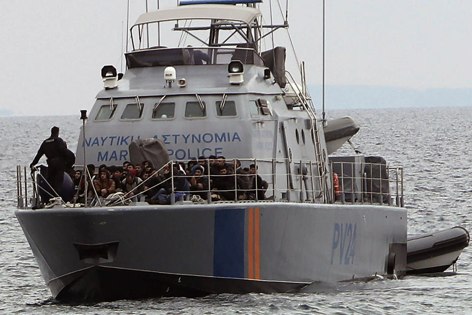 FILE - Migrants aboard a Cyprus marine police patrol boat as they're brought to a harbor after being rescued from their own vessel off the Mediterranean island nation's southeastern coast of Protaras, Cyprus, Tuesday, Jan. 14, 2020. The United Nations agency for refugees says on Friday, April 29, 2024, Cypriot efforts at sea to stop numerous Syrian refugee-laden boats departing Lebanon from reaching the European Union-member island nation mustn't contravene international human rights laws. (AP Photo/Petros Karadjias, File)