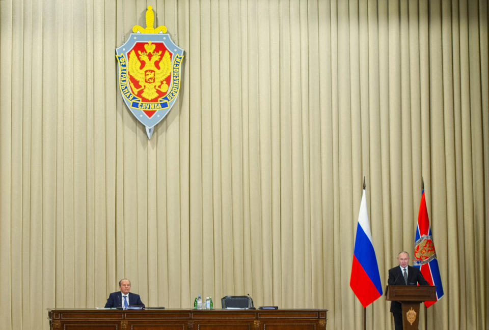 Russian President Vladimir Putin, right, and Federal Security Service Director Alexander Bortnikov attend a meeting of the Federal Security Service (FSB) board in Moscow, Russia, on Wednesday, Feb. 24, 2021. (Alexei Druzhinin, Sputnik, Kremlin Pool Photo via AP)