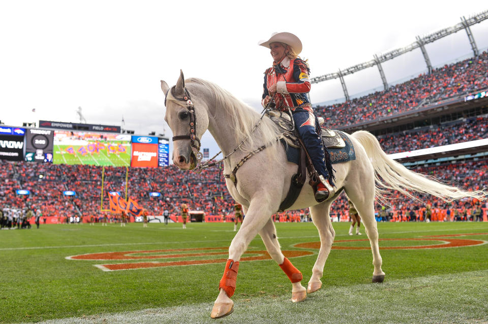 DENVER, CO - NOVEMBER 14: Ann Judge rides Denver Broncos live mascot Thunder across the field after a Denver Broncos score during a game between the Denver Broncos and the Philadelphia Eagles at Empower Field at Mile High on November 14, 2021 in Denver, Colorado. (Photo by Dustin Bradford/Icon Sportswire via Getty Images)