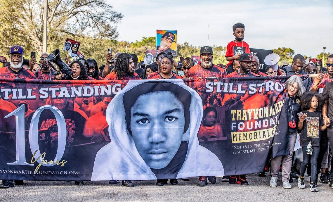 In February 2022, on the 10th anniversary of the death of Trayvon Martin, hundreds of people joined his family including (from left center) his brother Jahvaris Fulton, mother Sybrina Fulton and father Tracy Martin during the annual Trayvon Martin Foundation Peace Walk and Peace Talk at Ives Estate Park in Miami Gardens. Local elected officials and artists, including Jamie Foxx, attended the event to remember Trayvon 10 years after his death, which was the first big case involving Florida’s controversial Stand Your Ground law.