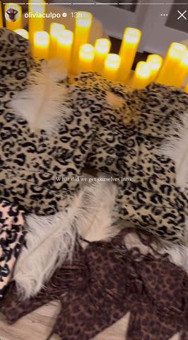 <p>Olivia Culpo/Instagram</p> Olivia Culpo posts Instagram video of bed filled with leopard print clothes.