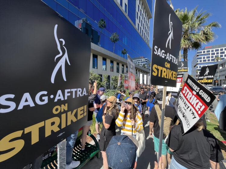 LOS ANGELES, CA - JULY 14: SAG-AFTRA members take to the picket line outside Netflix in Los Angeles, CA on Friday, July 14, 2023. Actors join striking writers who have been on the picket lines since the beginning of May. (Myung J. Chun / Los Angeles Times)