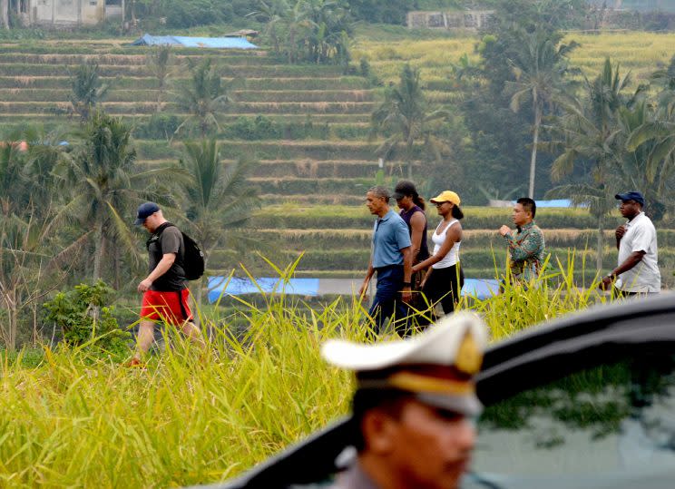 President Barack Obama, First Lady Michelle Obama, and First Daughter Sasha Obama touring the Balinese rice fields in Indonesia. (Photo: Getty Images)