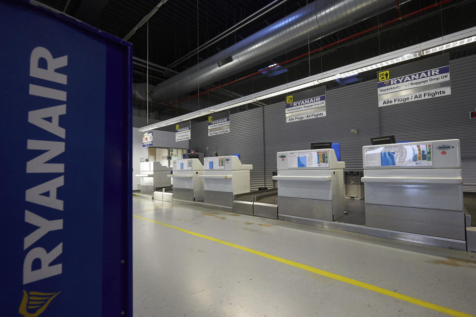 Check-in counters of Irish Ryanair airline are unstaffed at the Hahn airport, western Germany, Friday, Aug. 10, 2018 when several flights were cancelled due to a strike of pilots. (Thomas Frey/dpa via AP)