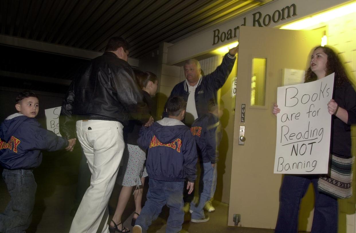 <span class="caption">A sign of the times</span> <span class="attribution"><a class="link " href="https://www.gettyimages.com/detail/news-photo/right-only-rebecca-breksa-27-of-fullerton-protests-the-news-photo/569150145" rel="nofollow noopener" target="_blank" data-ylk="slk:Geraldine Wilkins/Los Angeles Times via Getty Images;elm:context_link;itc:0;sec:content-canvas">Geraldine Wilkins/Los Angeles Times via Getty Images</a></span>