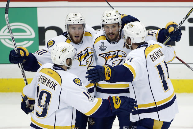 Nashville Predators’ Colton Sissons, left rear, celebrates with teammates after scoring a goal against the Pittsburgh Penguinsduring the third period in Game 1 of the NHL hockey Stanley Cup Finals, Monday, May 29, 2017, in Pittsburgh. (AP Photo/Gene J. Puskar)
