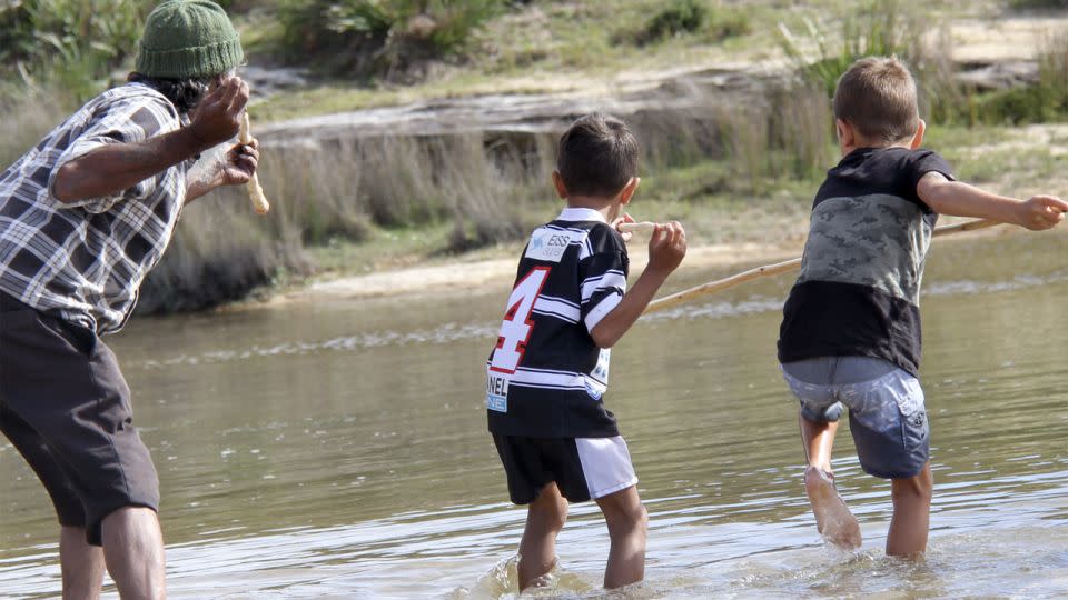 Gweagal Elder Uncle Rod Mason (left) at a spear making cultural camp. - National Museum of Australia