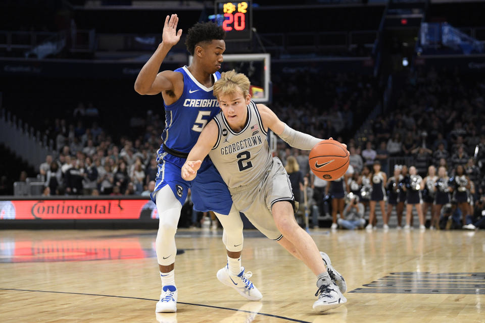 Georgetown guard Mac McClung (2) drives to the basket against Creighton guard Ty-Shon Alexander (5) during the second half of an NCAA college basketball game, Wednesday, Jan. 15, 2020, in Washington. Georgetown won 83-80. (AP Photo/Nick Wass)