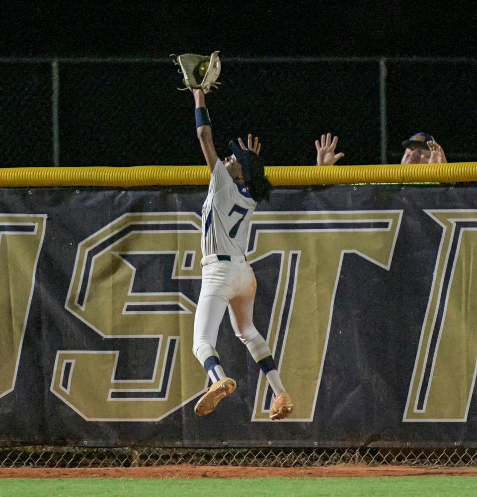 Eustis centerfielder Ciara Maple (7) makes a leaping catch to save a home run during the Class 4A-Region 2 semifinal game against Orlando Bishop Moore in Eustis on May 17, 2022.