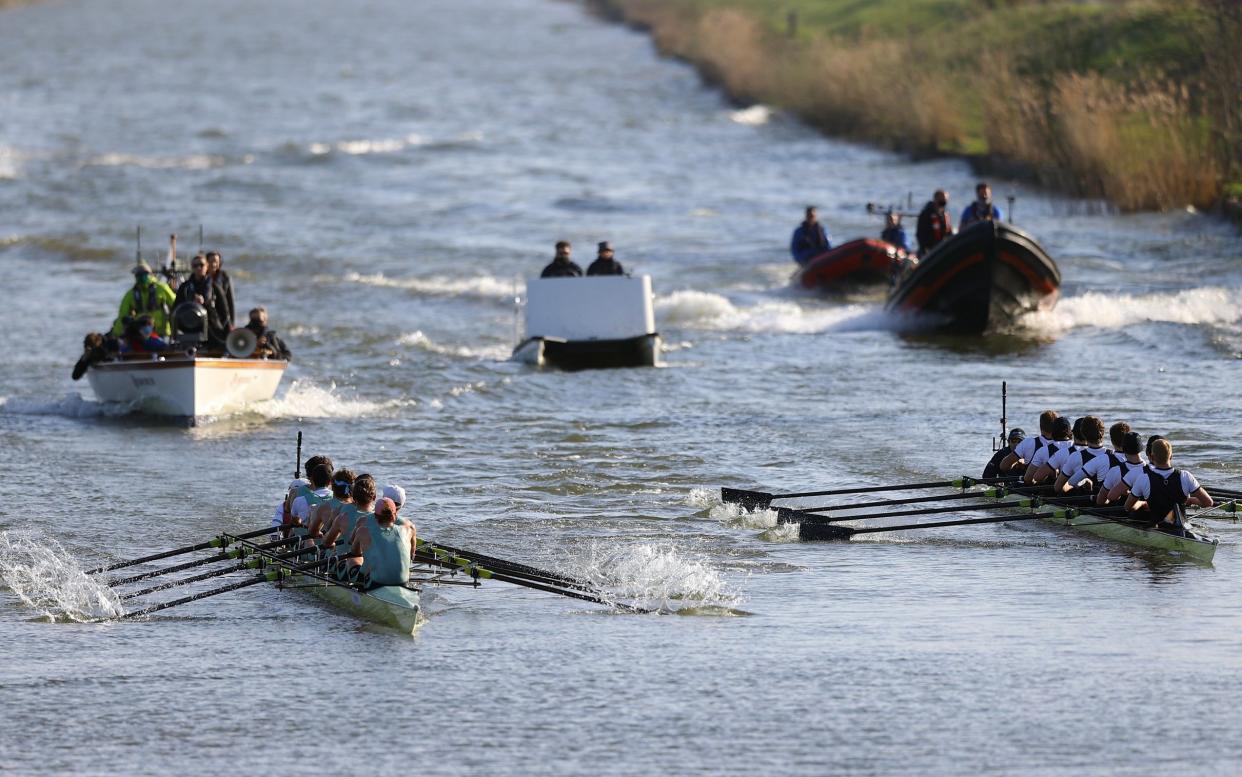 Teams of Oxford University Men's Boat Club and Cambridge University Men's Boat Club make their way along the River Great Ouse - Naomi Baker/Getty Images Europe 