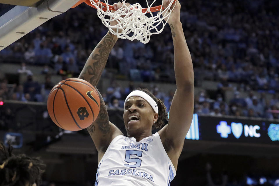FILE - North Carolina forward Armando Bacot (5) dunks against Duke during the first half of an NCAA college basketball game, Saturday, Feb. 5, 2022, in Chapel Hill, N.C. Bacot was named to The Associated Press preseason All-America team, Monday, Oct. 24, 2022.(AP Photo/Chris Seward, File)
