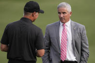 PGA Commissioner Jay Monahan, right, speaks with International team captain Trevor Immelman after the USA team won a singles match at the Presidents Cup golf tournament at the Quail Hollow Club, Sunday, Sept. 25, 2022, in Charlotte, N.C. (AP Photo/Chris Carlson)