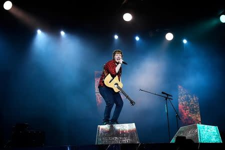 Ed Sheeran performs on the Pyramid Stage at Worthy Farm in Somerset during the Glastonbury Festival in Britain, June 25, 2017. REUTERS/Dylan Martinez