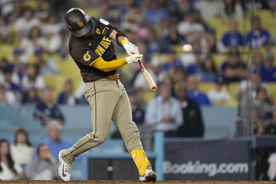 San Diego Padres' Kyle Higashioka connects for a solo home run during the ninth inning in Game 2 of a baseball NL Division Series against the Los Angeles Dodgers, Sunday, Oct. 6, 2024, in Los Angeles. (AP Photo/Mark J. Terrill)