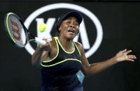 United States'Venus Williams makes a forehand return to compatriot Cori "Coco" Gauff during their first round singles match at the Australian Open tennis championship in Melbourne, Australia, Monday, Jan. 20, 2020. (AP Photo/Dita Alangkara)