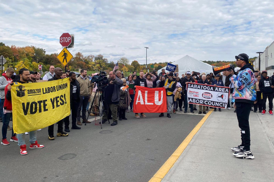 Chris Smalls, right, the head of the Amazon Labor Union, speaks to Amazon workers and supporters at the rally in Castleton-On-Hudson, about 15 miles south of Albany, N.Y., Monday, Oct. 10, 2022. The startup union that clinched a historic labor victory at Amazon earlier this year is slated to face the company yet again, aiming to rack up more wins that could force the reluctant retail behemoth to the negotiating table. (Rachel Phua via AP)