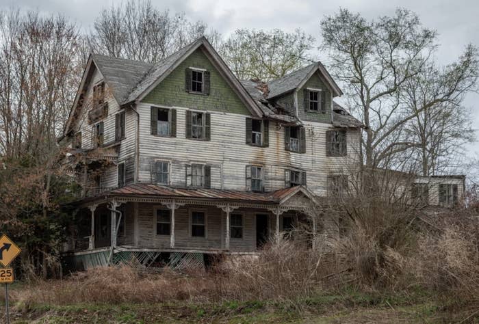 An abandoned house is shown