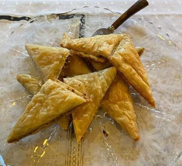 Pistachio baklava pairs with vanilla oat milk soft serve ice cream at the Epochary Inn in Ambridge.