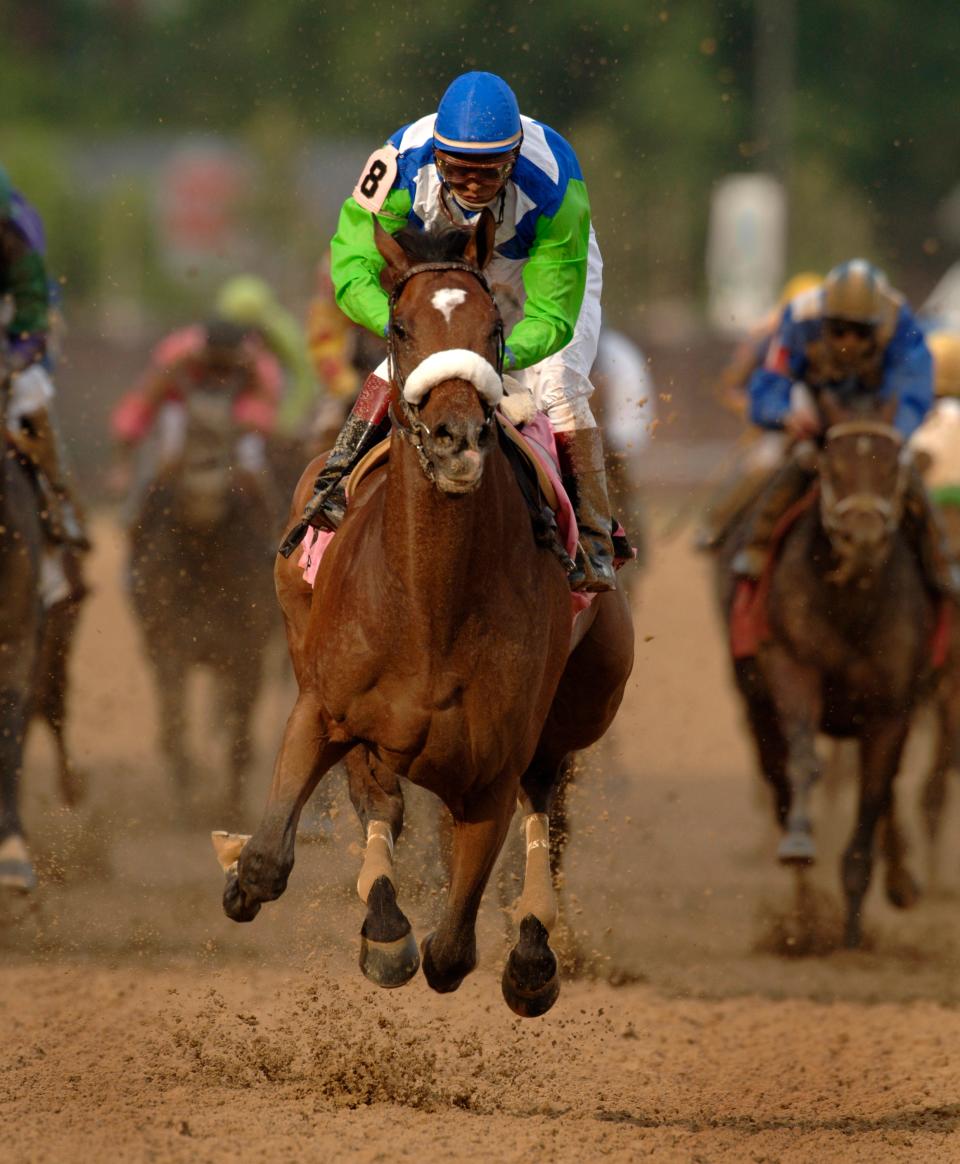 Edgar Prado aboard Barbaro crosses the finish line to win the Kentucky Derby. May 6, 2006