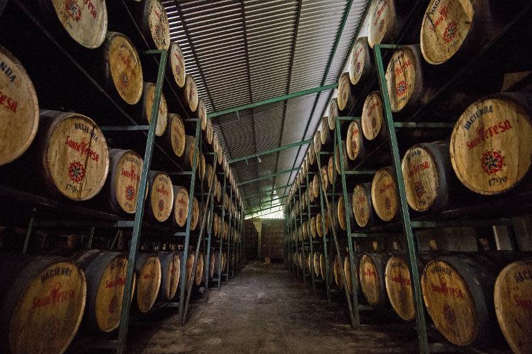 Rum barrels are stacked in a warehouse for aging at the Santa Teresa rum factory, in La Victoria, Venezuela