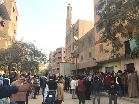 People are seen outside the Mar Mina Church after a blast, in Helwan district on the outskirts of Cairo, Egypt after a blast December 29, 2017. REUTERS/Amr Abdallah Dalsh