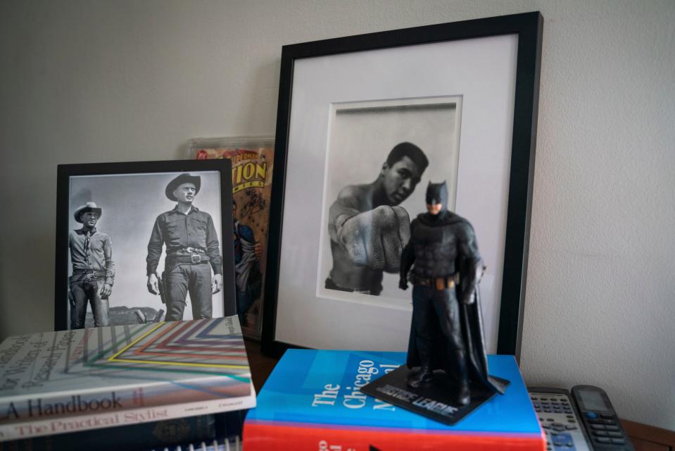 Old photographs and a batman action figure are seen in the office of Len Niehoff, a professor at the University of Michigan Law School, at Hutchins Hall in Ann Arbor on Wednesday, August 30, 2023.