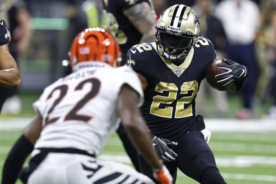 New Orleans Saints running back Mark Ingram II (22), right, runs against Cincinnati Bengals cornerback Chidobe Awuzie (22), left, during the first half of an NFL football game in New Orleans, Sunday, Oct. 16, 2022. (AP Photo/Butch Dill)