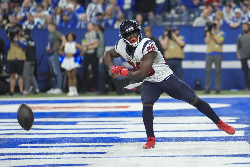 Houston Texans running back Devin Singletary (26) celebrates his rushing touchdown during the second half of an NFL football game against the Indianapolis Colts, Saturday, Jan. 6, 2024, in Indianapolis. (AP Photo/Michael Conroy)