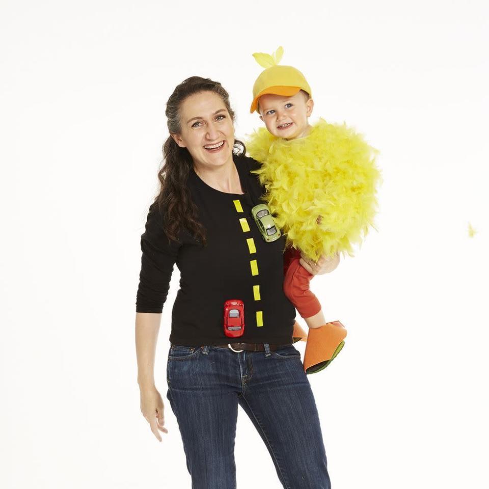 <p>You may not know why the chicken crossed the road, but you know this costume is sure to be a winner (and if you have more than one kid, then just add another chicken!). </p><p>Get the <strong><a href="https://www.womansday.com/style/fashion/a28680113/chicken-and-road-costume/" rel="nofollow noopener" target="_blank" data-ylk="slk:Chicken and Road tutorial" class="link ">Chicken and Road tutorial</a></strong>. </p>