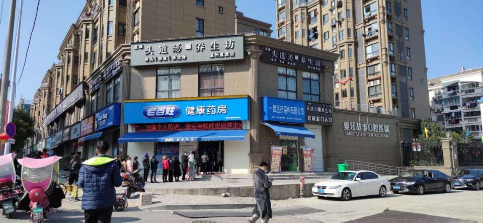 Lines form outside a pharmacy in Wenzhou, Zhejiang, China on Jan. 31, 2020.