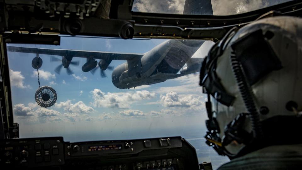 A KC-130 Hercules with Marine Aerial Refueler Transport Squadron 234 refuels a MV-22B Osprey with Marine Medium Tiltrotor Squadron 764, both with Marine Aircraft Group 41, 4th Marine Aircraft Wing, during an aerial refueling training mission in the air over Canadian Forces Base Cold Lake, Canada, June 17, 2019, in support of Sentinel Edge 19. (Lance Cpl. Jose Gonzalez/ Marine Corps)