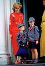 Princess Diana with her sons Prince Harry (L) and Prince William as they head to school at Wetherby Boys School in Notting Hill, west London on September 12, 1989. (Photo by Tim Graham/Getty Images)