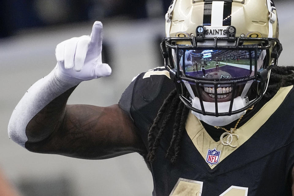 New Orleans Saints running back Alvin Kamara reacts after scoring a long touchdown run against the Dallas Cowboys during the first half of an NFL football game, Sunday, Sept. 15, 2024, in Arlington, Texas. (AP Photo/Tony Gutierrez)