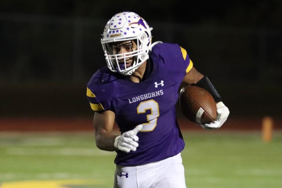 Early's Tre Beam rushes in the Longhorns' playoff game against Pilot Point on Nov. 12. He rushed for 14 touchdowns as a senior.