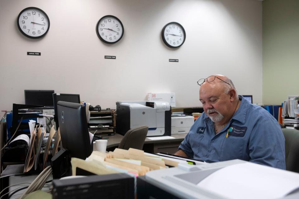 “All I’m doing now is a billion jobs,” jokes Todd Mangan, who works at Treasure Coast Newspaper’s production facility Friday, Jan. 14, 2022, in Port St. Lucie.