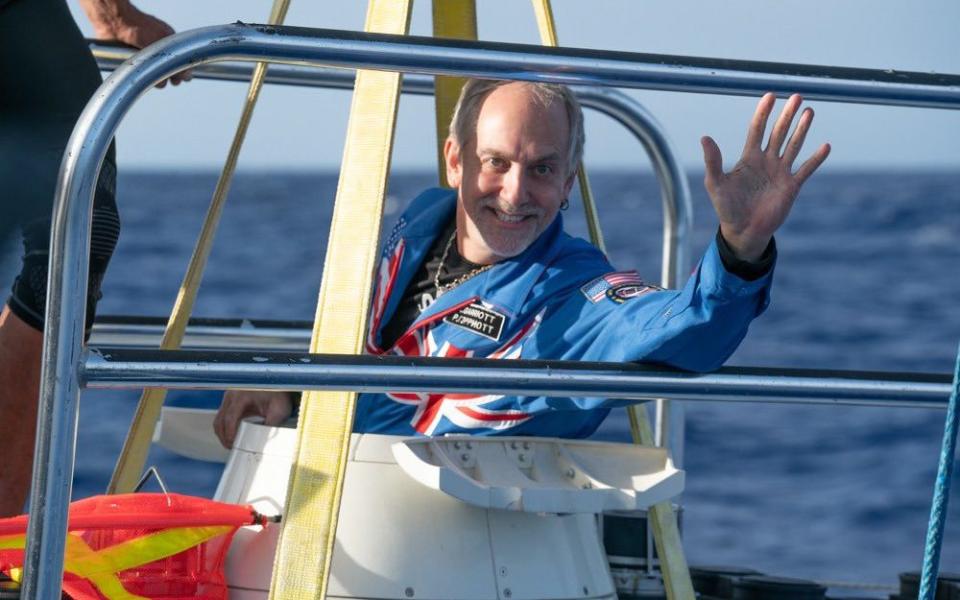 Richard Garriott, a dual British-American national, made sure to wear the same suit that he wore into space, which features both the Union Jack and the American Stars and Stripes.   