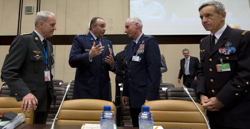 U.S. Air Force Gen. Philip Breedlove, the Supreme Allied Commander in Europe, second left, speaks to colleagues during a meeting of the North Atlantic Council with Non-NATO ISAF Contributing Nations at NATO headquarters in Brussels on Wednesday, April 2, 2014. (AP Photo/Virginia Mayo)