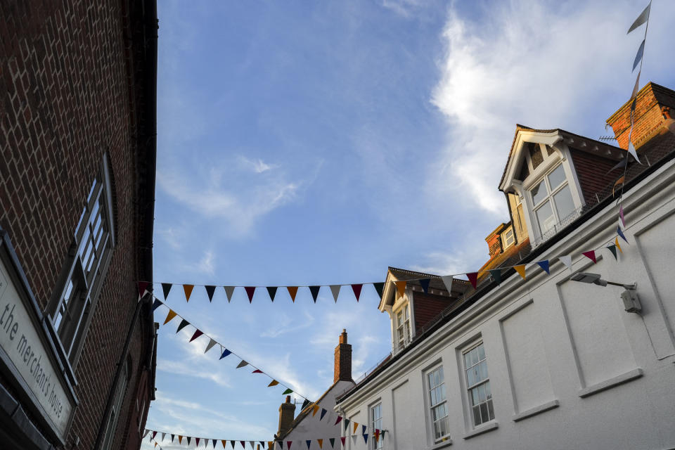 Sample image taken with the Sony FE 16-35mm F2.8 GM II of bunting between quaint UK buildings