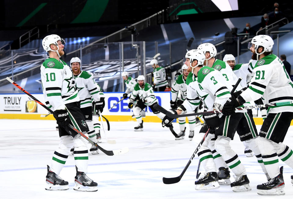 EDMONTON, ALBERTA - SEPTEMBER 26: Corey Perry #10 of the Dallas Stars celebrates with teammates after Perry scored the game-winning goal in the second overtime period of Game Five of the 2020 NHL Stanley Cup Final between the Dallas Stars and the Tampa Bay Lightning at Rogers Place on September 26, 2020 in Edmonton, Alberta, Canada. The Stars defeated the Lightning 3-2 in overtime.  (Photo by Andy Devlin/NHLI via Getty Images)