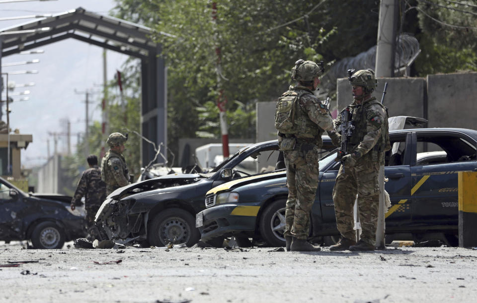 Resolute Support (RS) forces inspect the site of a car bomb explosion in Kabul, Afghanistan, Thursday, Sept. 5, 2019. A car bomb rocked the Afghan capital on Thursday and smoke rose from a part of eastern Kabul near a neighborhood housing the U.S. Embassy, the NATO Resolute Support mission and other diplomatic missions. (AP Photo/Rahmat Gul)