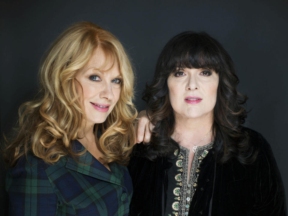 This Oct. 1, 2012 file photo shows sisters Nancy, left, and Ann Wilson from Heart in New York. The eclectic group of rockers Rush and Heart, rappers Public Enemy, songwriter Randy Newman, "Queen of Disco" Donna Summer and bluesman Albert King will be inducted into the Rock and Roll Hall of Fame April 18, 2013, in Los Angeles. (Photo by Victoria Will/Invision/AP)
