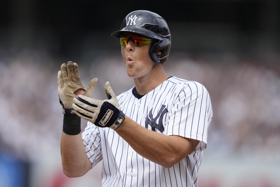 New York Yankees' DJ LeMahieu reacts after hitting an RBI single off Minnesota Twins starting pitcher Pablo Lopez (49) in the third inning of a baseball game, Sunday, April 16, 2023, in New York. (AP Photo/John Minchillo)