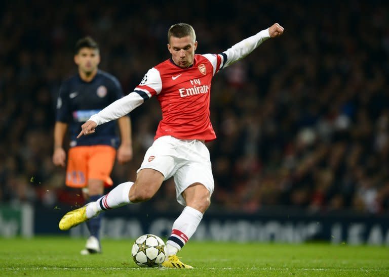 Arsenal's German striker Lukas Podolski plays against Montpellier at the Emirates Stadium in London on November 21, 2012. Podolski has said he is relishing the chance to "rock" the Gunners alongside his Germany team-mate Mesut Ozil after the latter signed a five-year deal