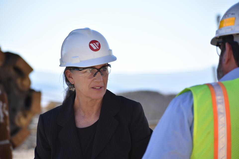 Democratic U.S. House candidate Monica Tranel speaks to Mark Thompson with Montana Resources at a copper mine operated by the company, in Butte, Mont., Wednesday, Oct. 19, 2022. Democrats have not won a House race in the state since 1994 but are hoping Tranel can defeat Republican Ryan Zinke and Libertarian John Lamb for Montana's 1st Congressional District seat in the Nov. 8, 2022 election. (AP Photo/Matthew Brown)