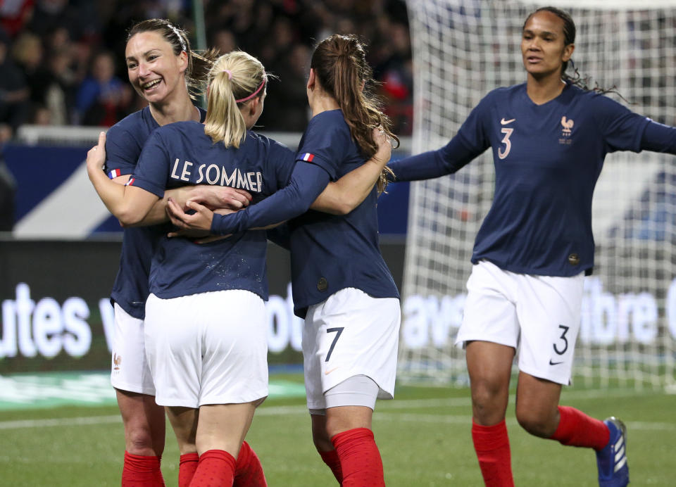 AUXERRE, FRANCE - APRIL 4: Eugenie Le Sommer of France celebrates her goal with Gaetane Thiney, Wendie Renard during the international friendly match between France and Japan at Stade de L'Abbe-Deschamps on April 4, 2019 in Auxerre, France. (Photo by Jean Catuffe/Getty Images)