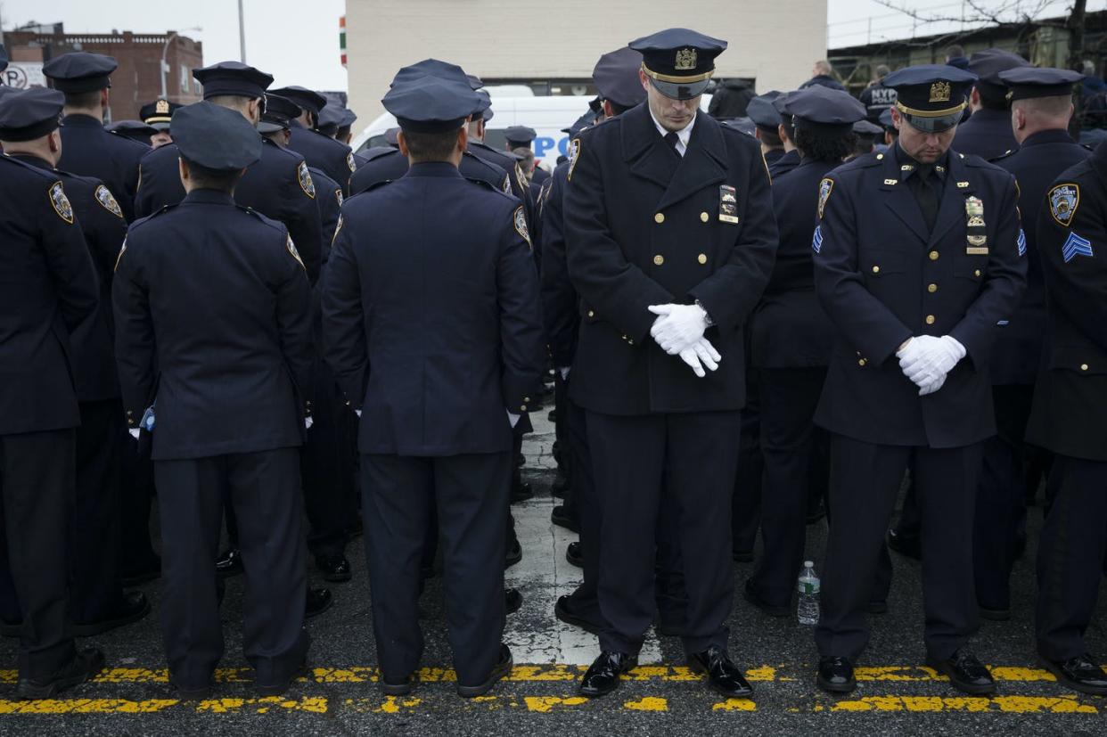 <span class="caption">NYPD officers turning their backs on New York mayor Bill de Blasio after he remarked on police violence, Jan. 4, 2015.</span> <span class="attribution"><a class="link " href="http://www.apimages.com/metadata/Index/NYPD-Protests-Poll/ee7425aee1c84e77b3a241a7e0cde9a3/31/0" rel="nofollow noopener" target="_blank" data-ylk="slk:AP Photo/John Minchillo,;elm:context_link;itc:0;sec:content-canvas">AP Photo/John Minchillo,</a></span>