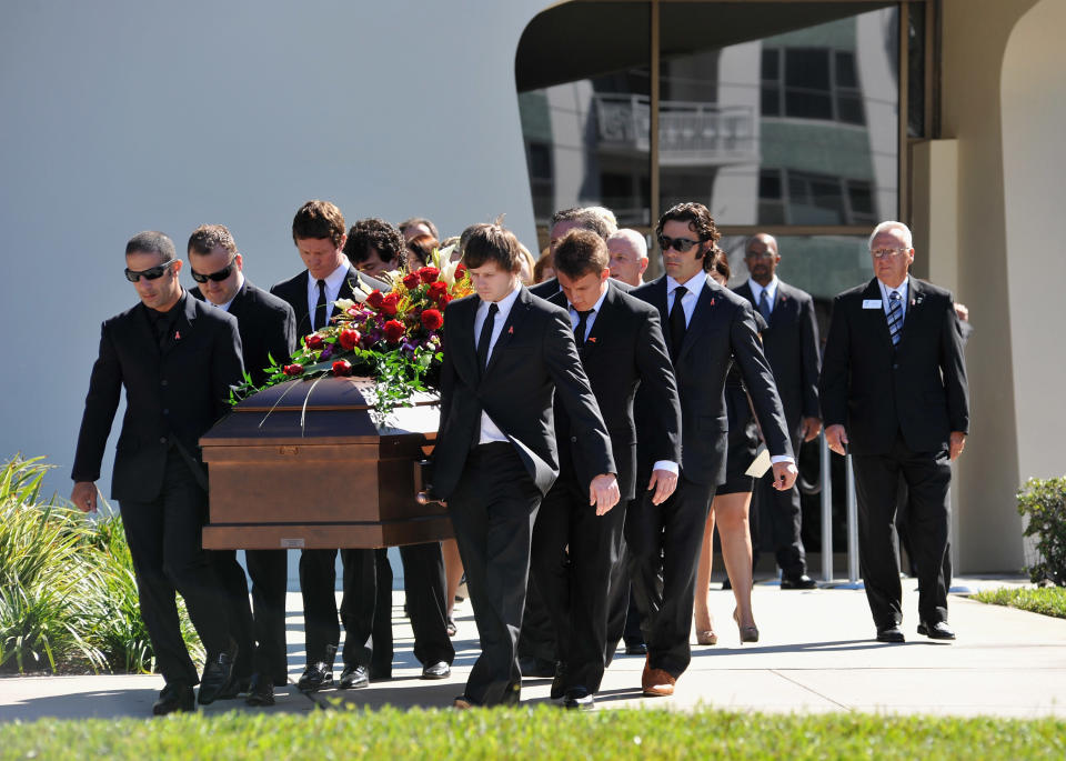 ST PETERSBURG, FL - OCTOBER 22: Pallbearers Austen Wheldon, Elliott Wheldon, Ashley Wheldon, Dario Franchitti, Scott Dixon and Tony Kanaan carry Dan Wheldon's casket to the hearse following a memorial service at First Presbyterian Church on October 22, 2011 in St Petersburg, Florida. Wheldon, who was 33 was killed in a 15-car crash at Sunday’s season-ending IndyCar race in Las Vegas. (Photo by Tim Boyles/Getty Images)